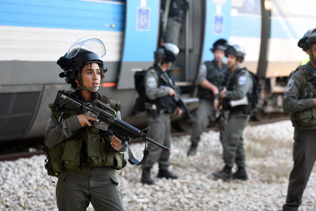 An Israel Police officer stands guard during a simulated terrorist attack on a train as Air Force Gen. Joseph Lengyel, chief, National Guard Bureau, visits Israel to observe Exercise Silver Jewel, Hadera, Israel, Nov. 8, 2016. The National Guard has a hom